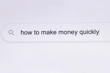 How to make money quickly - internet browser search bar question typing text. Typing the word How to make money quickly in the browser on a pixelated computer screen.