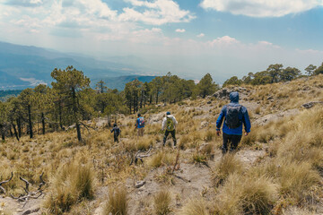 Obraz premium a Group of people enjoying being on mountain peak