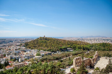 Fototapeta na wymiar Panoramic view of Athens city, Odeon of Herodes building, Filopappou Hill, Greece