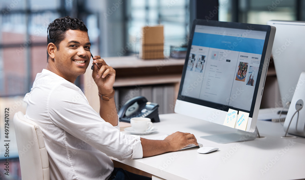 Poster taking care of your inquiries with speed. portrait of a young businessman working on a computer in a