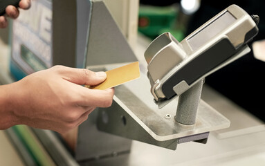 Making payment a breeze. Shot of an unidentifiable person paying for groceries by using a credit card machine.