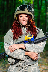 Ukranian female soldier in the forest