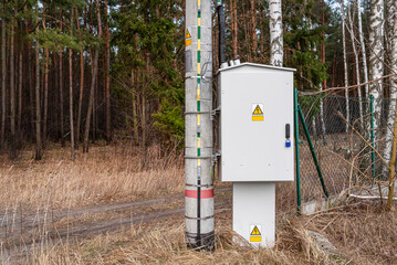 The ground plate is attached to the concrete pole from the low voltage transformer station, the...