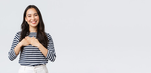 Lifestyle, people emotions and casual concept. Touched tender smiling asian woman gladly receive...