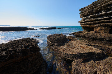 Cliffs with a turquoise blue sea under a cloudless sky