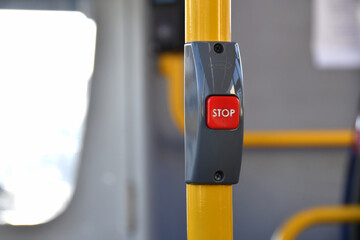 Close-up view of a push button inside a bus to signal to the driver to stop at the next bus stop....