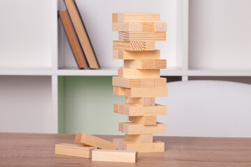 construction of pieces or wooden cubes forming a tower puzzle