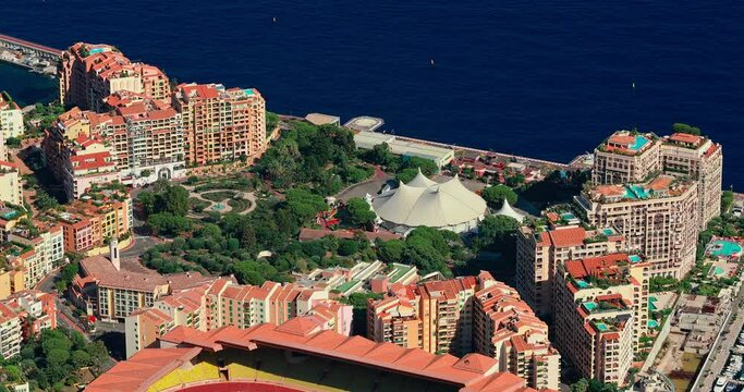 Aerial view of luxury apartments near port Cap Dail at sunset, France, a lot of boats are moored in marina, view of city life from La Turbie mountain, mega yachts