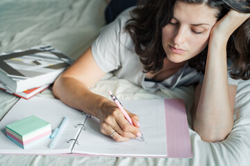 Woman, young girl writes morning pages,takes notes in personal diary of thoughts, mental health....