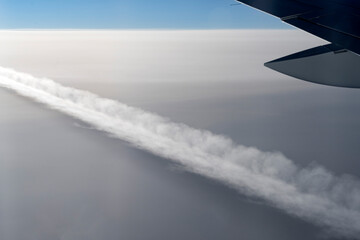 trace of a flying plane taken from the window