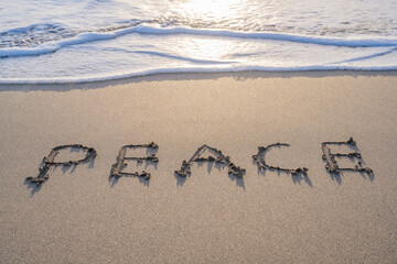 writing on the sand peace