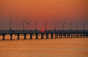Naklejka premium pontoon at the Black Sea at sunrise