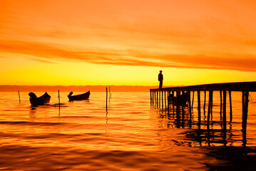 Fototapeta premium fishing boats at sunrise on the shores of Lake Razim