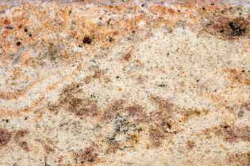 Granite texture, granite slab background, yellow marble stone. Decorative element of old building fasade. Empty space for text