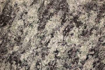 Granite texture, granite slab background, grey and white marble stone. Decorative element of old building fasade. Empty space for text.