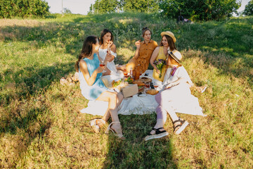Summer party, Outdoor Gathering with friends. Five young women, Friends at the picnic dancing and...
