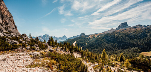 Mountain climber on a steep and exposed Via Ferrata Col dei Bos near passo falzarego. Majestic...