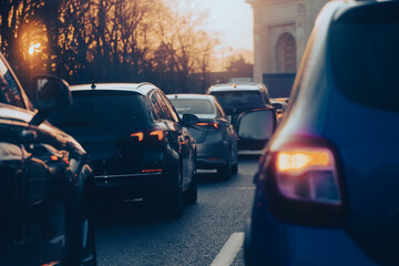 traffic. cars caught in the crowd. photo taken in the evening. people in traffic returning from work