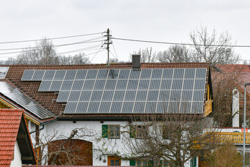 Solar panels on the roof of a private house. The concept of free solar electricity.