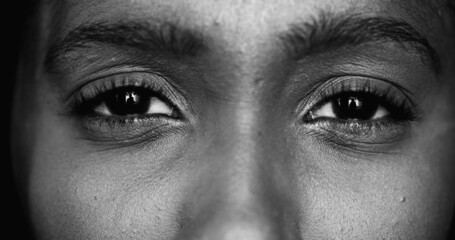Naklejka premium Black and white African ethnicity woman eyes, monochrome macrz
