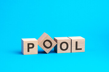 pool - text on wooden blocks, business concept, blue background