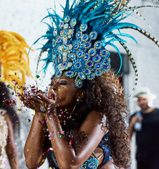 All this glitter is gold. Cropped shot of a beautiful samba dancer performing in a carnival with...