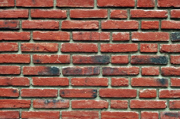 Part of the old vintage brick wall. Red brick wall background texture.