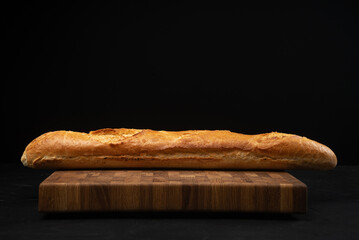 Baguette close-up. Baguette side view. Art bread.