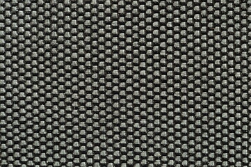 Closeup black plastic mat. Background texture with intertwined bands.
