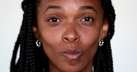 African woman grimacing making funny faces to camera. Expressive fun portrait