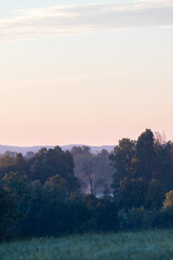 Fototapeta premium Sunrise Over a Valley Filled with Trees | Amish Country, Ohio