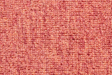 Closeup of pink carpet texture background.