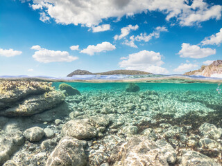 Fototapeta na wymiar Split underwater view of La Speranza rocky seabed