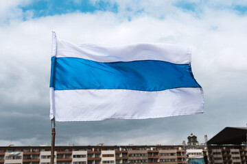 Russian new opposition white-blue-white stripped flag waving in concert for Ukraine in Prague,...