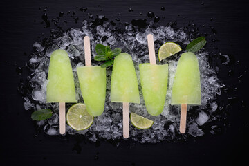 Homemade popsicles with lime juice and mint, mojito fruit ice 