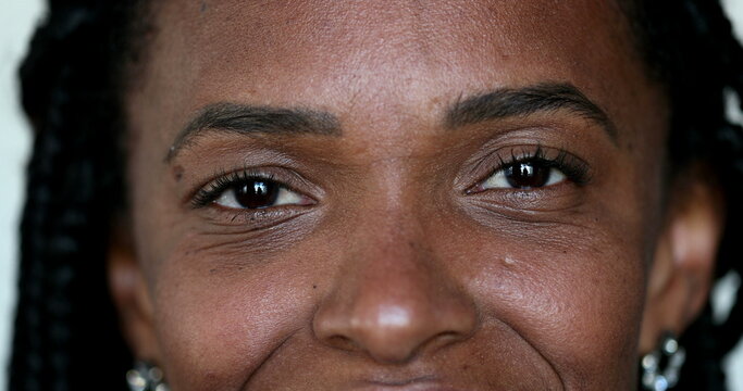 African black woman smiling at camera, macro close-up eyes fce