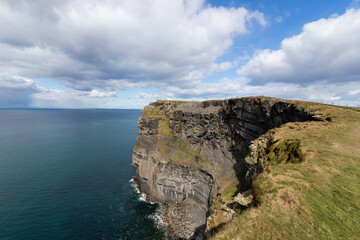 Fototapeta na wymiar Cliffs of Moher, sea cliffs. The Burren region in County Clare, Ireland