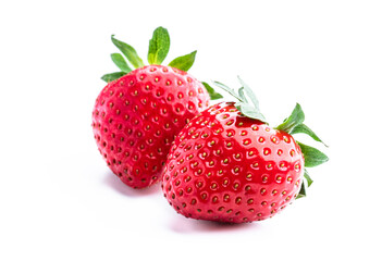 Two strawberries close up isolated on white background