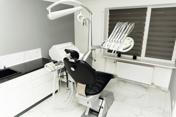 modern dental office. dental chair and equipment with tools for dental treatment. dental clinic.