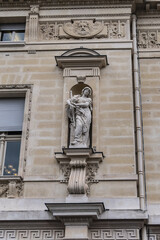 Fototapeta na wymiar Architectural details of old buildings in Paris: The Criminal Court of Paris (Tribunal Correctionnel) at 14 Quai Goldsmiths. Paris. France.