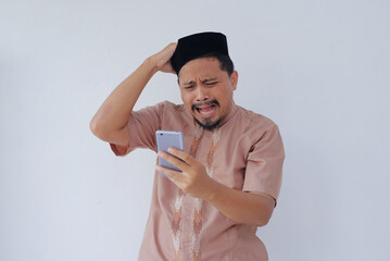 funny expression of asian man while looking phone screen