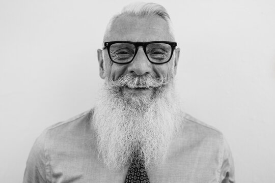Business senior hipster man smiling on camera - Focus on face - Black and white editing