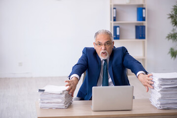 Old male employee and too much work in the office