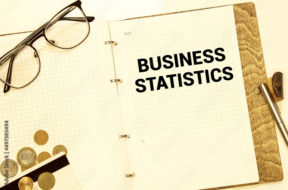 Poster text business statistics on sticker on notepad on diagram background