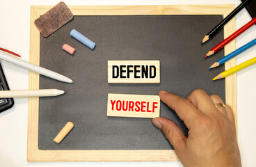 man puts together the phrase - defend yourself