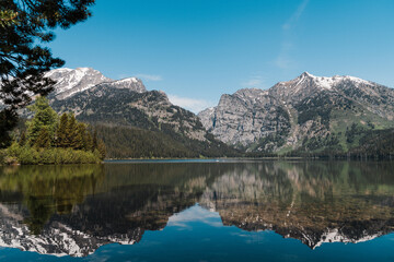 Fototapeta na wymiar A mountain reflection on Taggart Lake in Grand Teton National Park