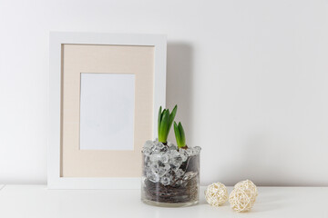 Blank canvas frame mockup. Artwork in interior design. View of modern scandinavian style interior with canvas for painting or poster on wall. Living room, commode with vases. Minimalism concept