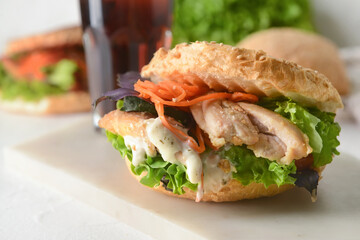 Fresh doner kebab in bun on table, closeup