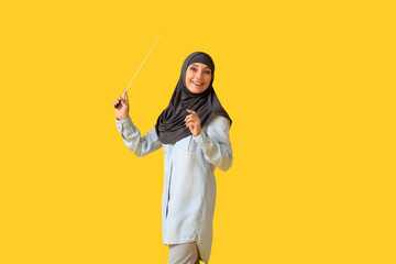 Muslim music teacher on color background
