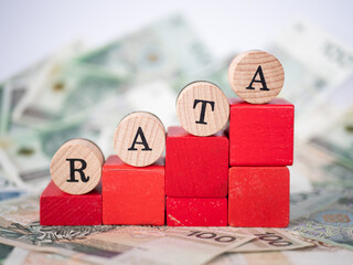 Word loan installment written in polish with wooden blocks, "rata" means loan installment